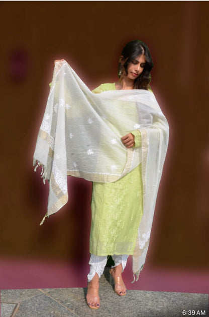 A woman holding a Chikankari Chanderi Silk Dupatta with intricate embroidery, dyeable fabric, and a luxurious sheen.