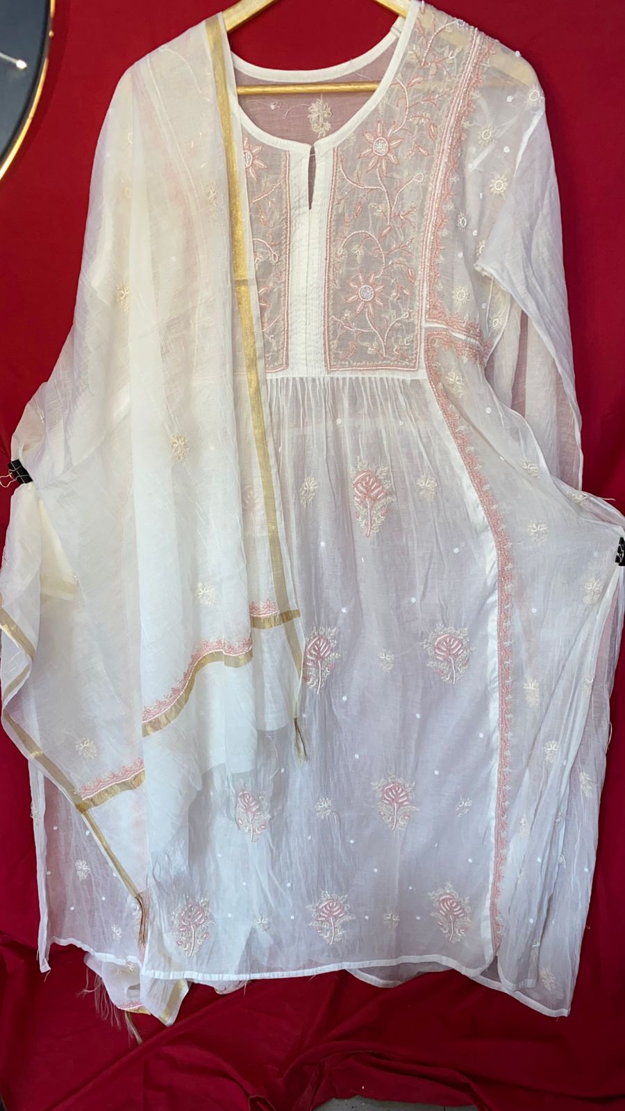 Elevate your ethnic wardrobe with this Pure Mul Chanderi semi-stitched gown featuring exquisite Chikankari embroidery and delicate pearl handwork. Paired with a graceful dupatta, this breathable and lightweight gown is perfect for festive occasions, weddings, and traditional gatherings. Customizable fit makes it ideal for all body types, blending comfort with elegance
