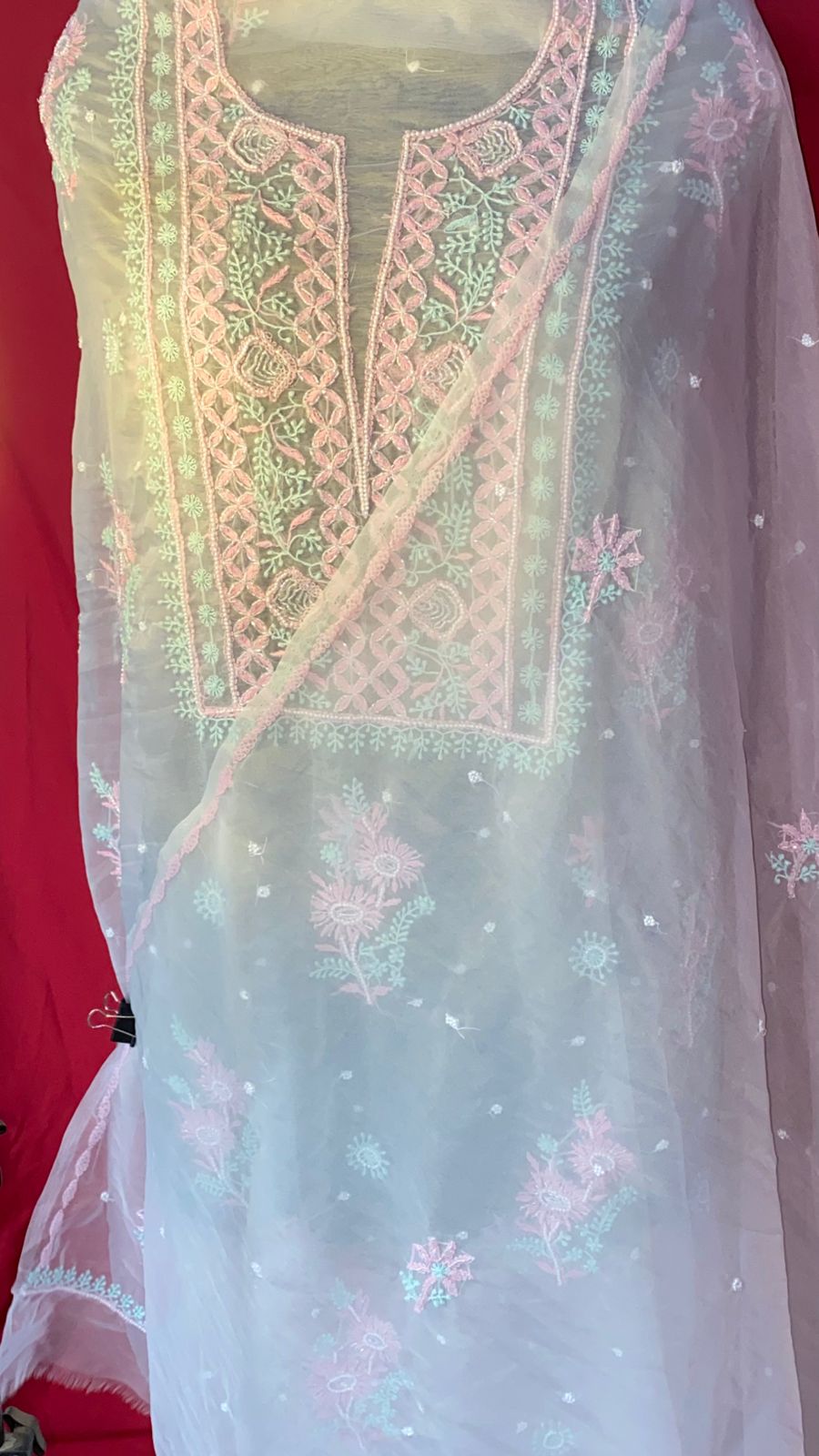 Experience timeless grace with this Pure Organza unstitched kurti and dupatta set, beautifully detailed with multicolor hand embroidery and delicate pearl embellishments. The sheer, lightweight fabric adds a luxurious feel, making it ideal for festive occasions, intimate gatherings, and statement ethnic looks. A perfect blend of elegance, tradition, and custom tailoring.